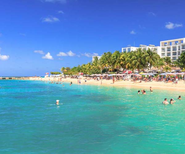 view of beach shore with resort in background