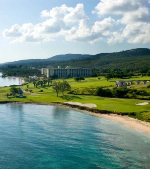 golf green from distance along beach