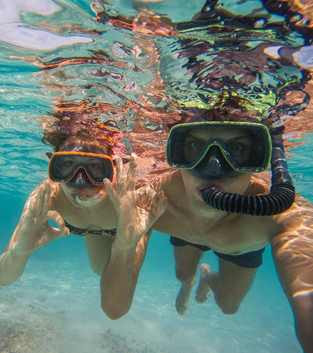 kids snorkeling underwater