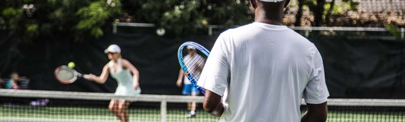 view of two people playing tennis