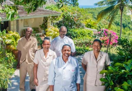 staff standing outdoors on sunny day